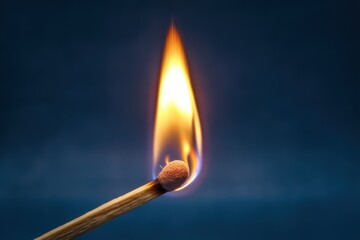 Close-up of igniting matchstick with visible spark and flame against a dark background