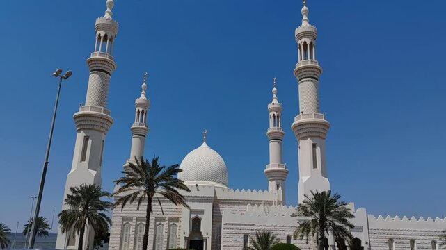 Beautiful Landscape mosque, Islamic background Mosque, Minaret of Mosque, Masjid design in Islamic religious architectural traditions. Sheikh Zayed Grand Mosque: AJMAN, UNITED ARAB EMIRATES.