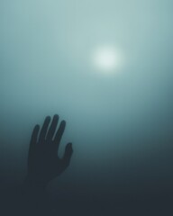 Silhouette of a Hand Reaching Through Fog: An ominous silhouette of a hand reaching through a thick fog towards a faint light in the distance. The image evokes a sense of mystery, hope.