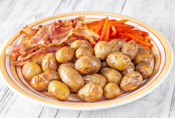 Crispy baked baby potatoes with smoky grilled bacon and red peppers