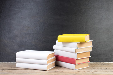 Books, books on the background school board. Back to school. Education. Copy space for text.