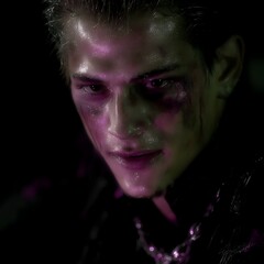 Intense Portrait of a Man with a Determined Gaze Lit with Purplish Hues Against a Dark Backdrop.