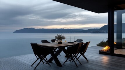 Coastal dining terrace at sunset.  Elevated dining area overlooking the ocean with a modern, minimalist design