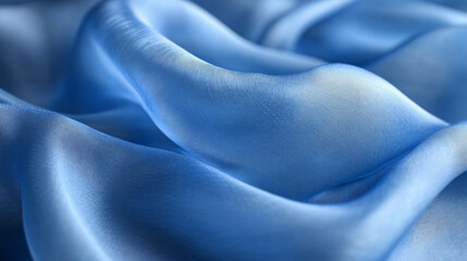 Obraz premium Flowing blue silk fabric soft textiles close-up abstract studio elegance and luxury