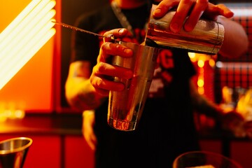 Mixing drinks with flair in a vibrant nightlife setting