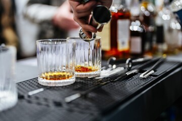 Mixing cocktails at an elegant bar during a lively evening gathering