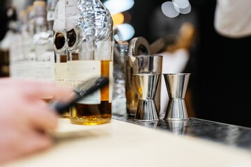 Crafting exquisite cocktails at a bustling city bar during evening hours