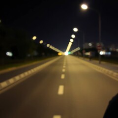 Night Road: A Dreamy, Blurred Cityscape at Dusk