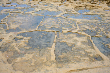 Sandstone bedrock, patterns of cracks and fissures, Malta. Secluded bays and beautiful coastline in Malta	
