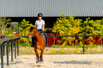 Wide shot and front view of teen girl control hose to walk in the arena during train or practice before competition.
