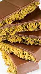 Trend Dubai Chocolate Bar with Green Kadayif Pistachio Paste and Peanut Butter on White Background