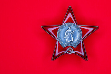 Naklejka premium Order of the Red Star - A model of the Order of the USSR. May 9 Victory Day. Translation of Russian inscriptions: Proletarians of all countries, unite!, USSR