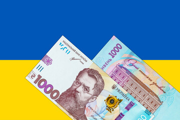 Ukrainian banknote 1000 hryvnia on the background of the flag of Ukraine. Paper money of Ukraine.
