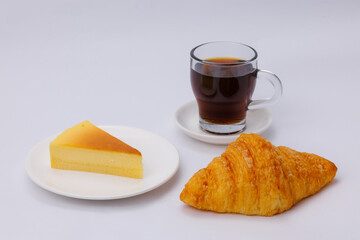 Flaky golden croissants and creamy cheesecake, served with bold black coffee — the perfect morning fuel before work