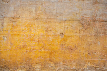 Processed collage of ancient yellow block wall texture. Background for banner, backdrop or texture for 3D mapping.A rectangular slab of light sandstone against the background of stone fragments as the