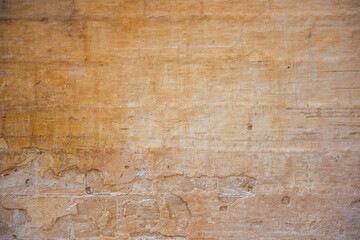 Processed collage of ancient yellow block wall texture. Background for banner, backdrop or texture for 3D mapping.A rectangular slab of light sandstone against the background of stone fragments as the