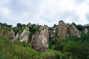 Lush Green Mountains and Rocky Peaks: A Beautiful Landscape