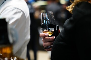 Elegant gathering featuring a cocktail in stylish surroundings with ambiance