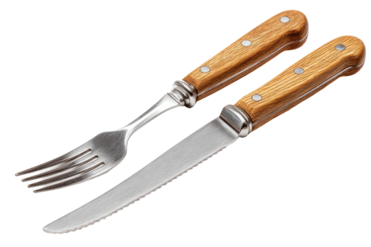 Rustic elegance: A gleaming silver fork and bread knife with warm oak handles, ready for a delightful meal.