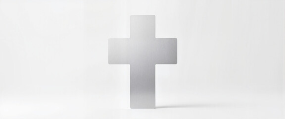 Obraz premium Modern silver cross against a minimalist white background 