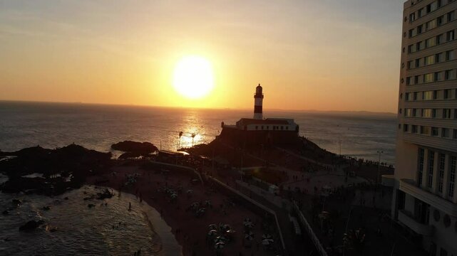 Sunset over Farol da&nbsp;Barra lighthouse, Salvador - orbital drone 4K
A dramatic  aerial orbit shot of the iconic Farol da Barra lighthouse and Salvador coastline at golden hour. 
