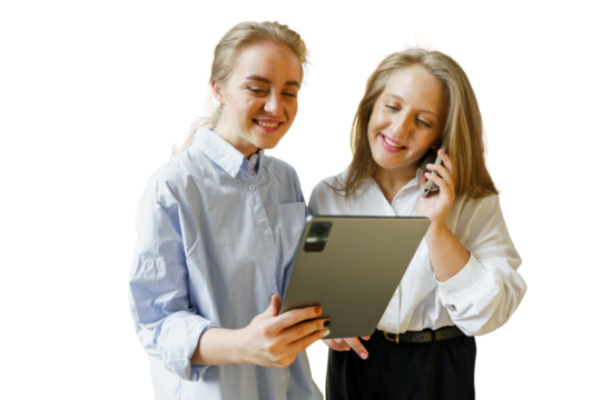 Two Women Engaged in a Lively Conversation While Using a Tablet in a Bright, Modern Environment