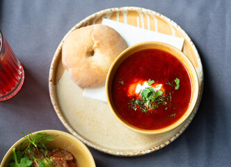 Borscht or borsch in bowl, Ukrainian beetroot soup. Red chowder thick borscht with sour cream