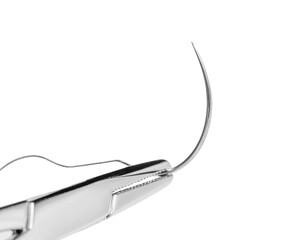 Close-up of a surgical needle threaded with suture. Sharp point and fine thread against a white background.