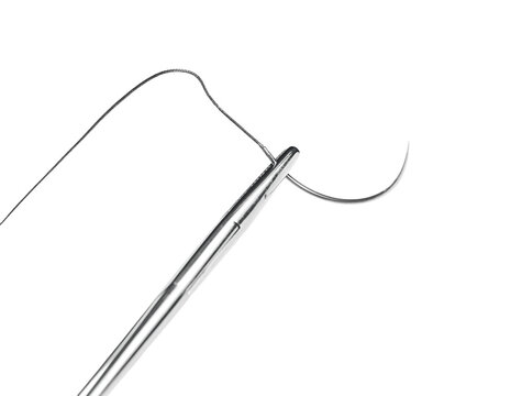Close-up of a surgical needle threaded with suture. Sharp point and fine thread against a white background.
