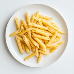 A top down view of a white plate filled with cooked penne pasta dish