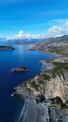 suggestive aerial view of blue sea of San nicola arcella beach located in Calabria in south Italy with old building of saracena tower named Torre Crawford in honor of famous American writer