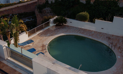 Oval pool on the roof of a house