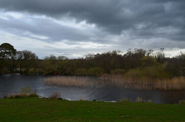 Very Dark Grey Clouds Over Waterway in Ireland