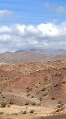 Geological formations shape vast landscapes, layered rock patterns revealing ancient shifts, weathered ridges sculpted by time, erosion carving striking geological formations in remote terrain.