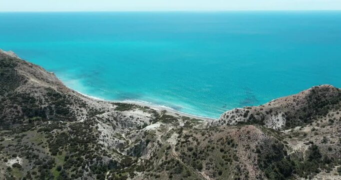 Aerial of the Aphrodite trail in Cyprus. Landscape of the steep, rocky coast of the Middle Sea, tourism and roads. High quality 4k footage