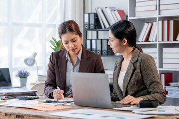 Two Businesswomen Collaborating in Office