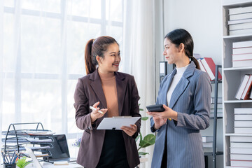 Businesswomen Discussing Work in Office