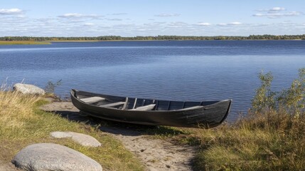 Naklejka premium Tranquil lake scene with traditional wooden boat.
