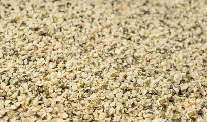 Shelled hemp seeds pile, peeled cannabis grains, marijuana kernels without peel