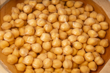Soaked chickpeas, chick pea in water, swollen wet Cicer arietinum fruits, garbanzo beans cooking