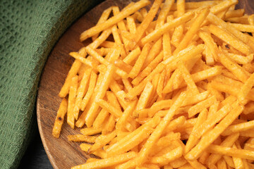 Fried chips sticks, finger potato chips, golden shoestring fries pile, French fries
