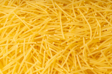 Raw vermicelli textured background, gold soup pasta pattern, small homemade noodles mock up