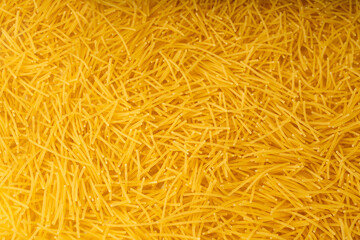 Raw vermicelli textured background, gold soup pasta pattern, small homemade noodles mock up