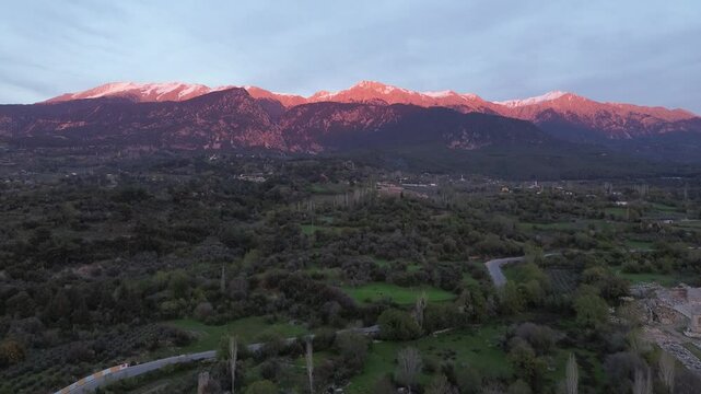 Sunset in the snow mountains, Turkey, green valley