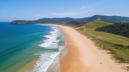 Panoramic view of a tranquil beach and coastline.
