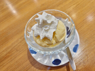 Vanilla ice cream topped with whipped cream