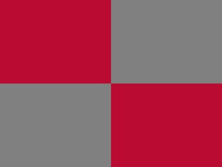 An abstract background with a simple, checkerboard pattern.  Two large squares of crimson red alternate with two large squares of gray.