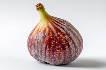 Fototapeta premium High quality studio photo of a fig cut in half, isolated on white, perfect for food photography or healthy eating concepts.