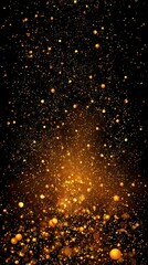 Golden particles raining down on a dark background