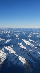 Obraz premium Snow Capped Mountain Peaks Aerial Drone Panorama